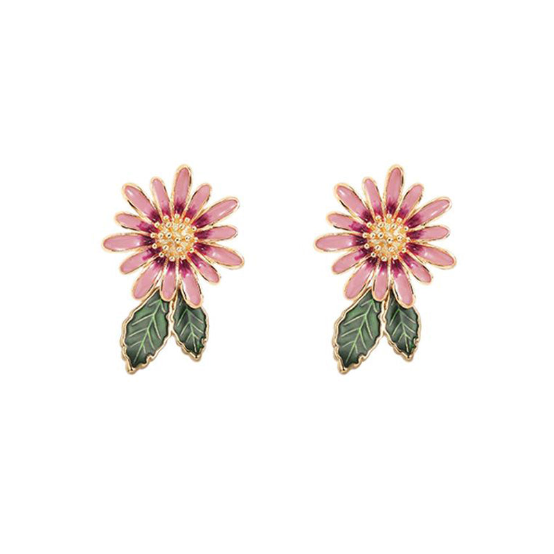 Elegantes aretes de perlas naturales hechos a mano con flores de margarita